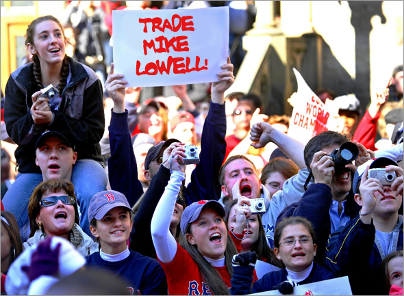 BDD Photo Illustration -- Fans line the streets of Boston during the 2008 rolling rally honoring the Wild Card Champion Boston Red Sox