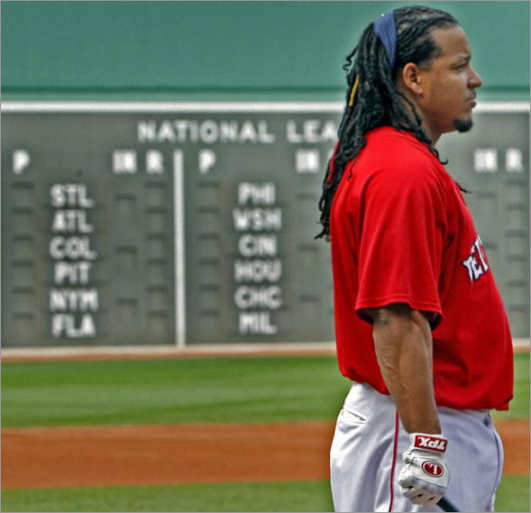Will he stay or will he go? By Thursday afternoon's trading deadline, Red Sox LF Manny Ramirez (shown during batting practice at right) could be playing for one of the teams shown on the scoreboard, or he could be staying put in Boston. 