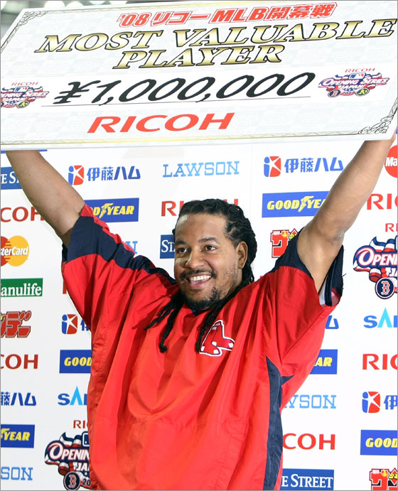 Outfielder Manny Ramirez #24 of Boston Red Sox holds up the MVP award for the first game of the MLB Opening Series against Oakland Athletics at Tokyo Dome on March 25, 2008 in Tokyo, Japan. Boston Red Sox defeated Oakland Athletics by 6-5.