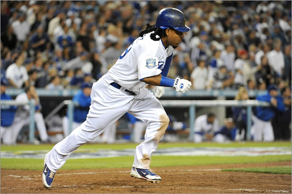 Manny Ramirez of the Los Angeles Dodgers hits a double in the eighth inning against the Philadelphia Phillies in Game Four of the National League Championship Series during the 2008 MLB playoffs on October 13, 2008 at Dodger Stadium in Los Angeles, California. 