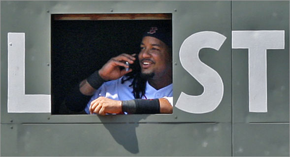 During a sixth inning pitching change, when Red Sox starting pitcher Josh Beckett was removed from the game, Red Sox left fielder Manny Ramirez went inside the Green Monster, and was seen smiling and apparently talking on someone's cellphone.