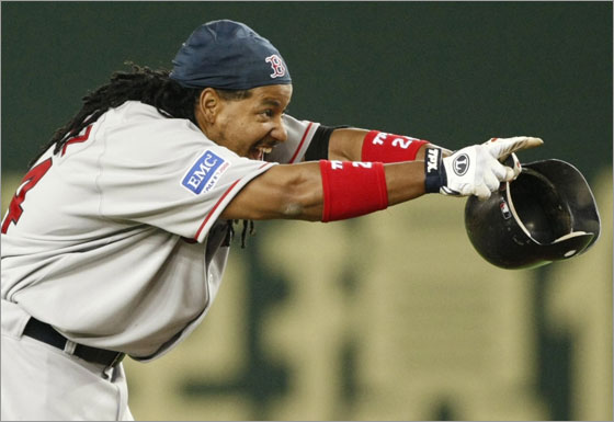 Manny Ramirez reacts after hitting a double for two RBIs against the Oakland Athletics in the 10th inning of their season opening MLB American League baseball game in Tokyo March 25, 2008.