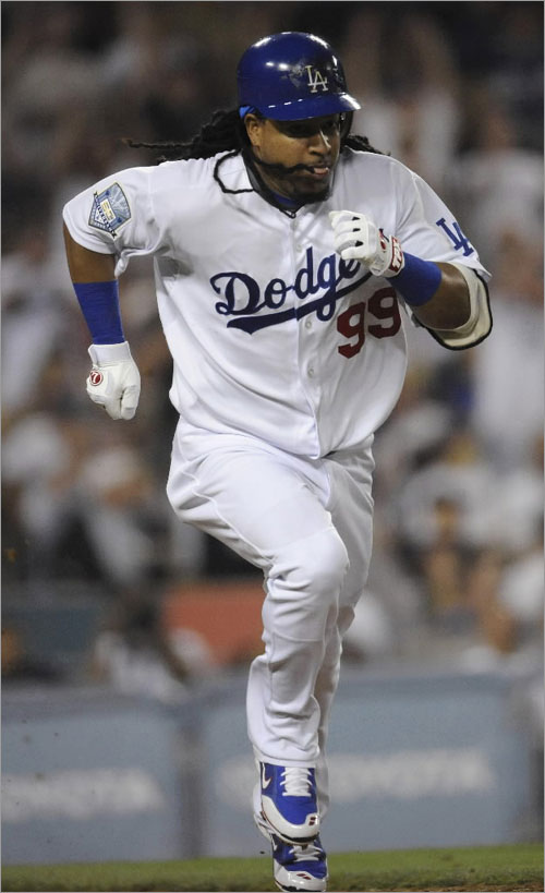 Los Angeles Dodgers Manny Ramirez runs to first base on a single against the Arizona Diamond Backs during the fourth inning of their MLB game in Los Angeles August 1, 2008. Ramirez was traded to the Los Angeles Dodgers in a three-team trade July 31, 2008. 