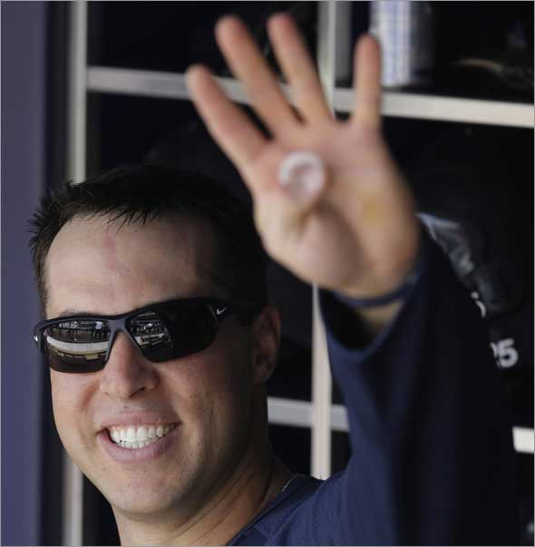 Mark Teixeira waves to fans from the dugout before taking batting practice before playing the Cleveland Indians in a Major League Baseball game Saturday, April 18, 2009 at Yankee Stadium in New York.