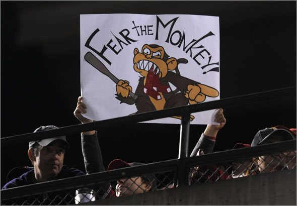 A fan of the Los Angeles Angels of Anaheim holds up a sign for the rally monkey during Game Two of the ALDS during the 2009 MLB Playoffs against the Boston Red Sox at Angel Stadium on October 9, 2009 in Anaheim, California. The Angels won the game 4-1. 