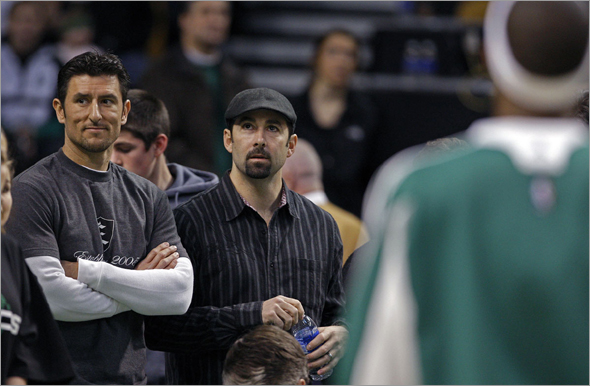 Lou Merloni and Nomar Garciaparra take in the Celtics-Mavs game on Sunday