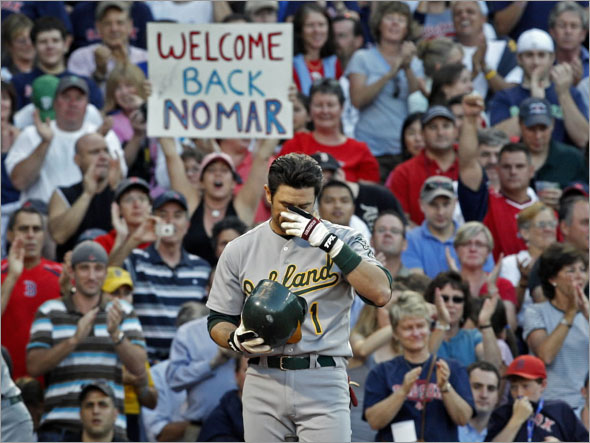 Former Red Sox shortstop Nomar Garciaparra was at Fenway Park in an oppostion uniform for the first time since being traded in the middle of the 2004 season, as his current employer, the Oakland Athletics opened a three game series vs. Boston. Here he gets emotional in front of the crowd as they give him a standing ovation.