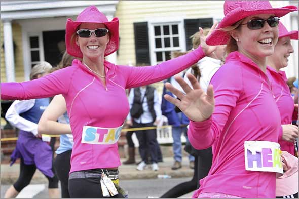 Three pink ladies were full of energy as they crossed the halfway point in Wellesley.