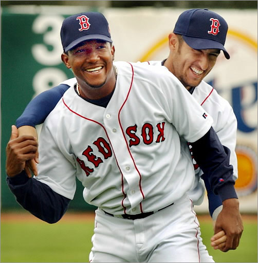 3-1-2002:Ft. Myers, Florida: Red Sox stars Pedro Martinez (left), and Nomar Garciaparra have some fun with each other in the outfield at City of Palms Park during afternoon workout. 