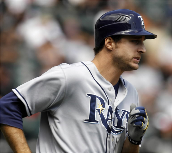 Tampa Bay Rays' Rocco Baldelli rounds the bases after hitting a two-run home run during the first inning of a baseball game against the Chicago White Sox, Sunday, Aug. 24, 2008 in Chicago.