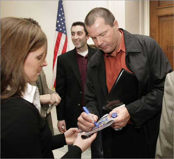 Major League Baseball pitcher Roger Clemens signs autographs after his meeting with Rep. Eleanor Holmes Norton (D-DC) on Capitol Hill in Washington