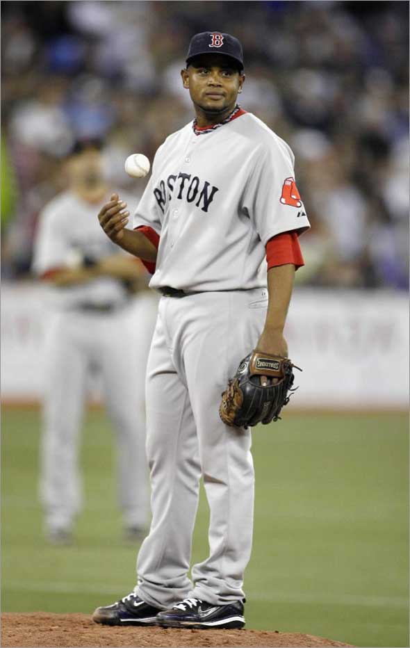 Red Sox pitcher Ramon Ramirez waits to be pulled after giving up the go ahead runs to the Toronto Blue Jays during the seventh inning of their MLB American League baseball game in Toronto, May 30, 2009.