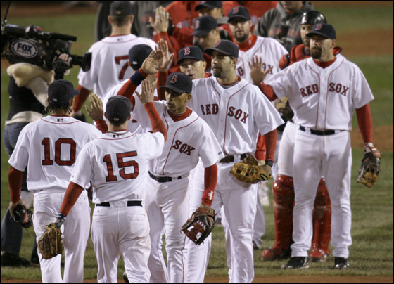 The Boston Red Sox celebrate their 10-3 win over the Cleveland Indians in Game 1 of the American League Championship baseball series Friday, Oct. 12, 2007, at Fenway Park in Boston. 
