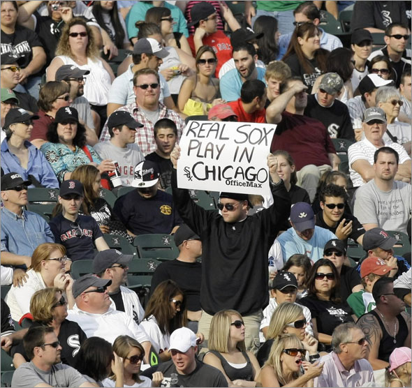A Chicago White Sox fan holds up a sign during the ninth inning of a baseball game against the Boston Red Sox, Saturday, Sept. 5, 2009, in Chicago.
