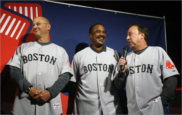 At an event held in the basement of the Game On restaurant, the Boston Red Sox unveiled an updated logo, as well as new primary road uniforms, and also  a new secondary road jersey, and a new hat to go with the secondary road jersey. Here team manager Terry Francona, (left) and former players Jim Rice (center) and Jerry Remy (right) show off the new primary road jersey.