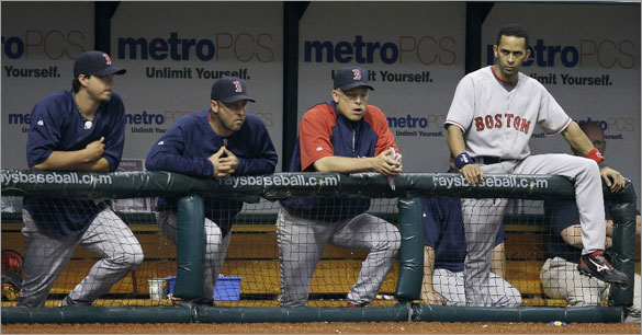 Boston Red Sox's, from left, Josh Beckett, Tim Wakefield, Brad Mills, and Julio Lugo look on in the ninth inning of the Tampa Bay Rays 5-4 win during a baseball game Monday, June 30, 2008 in St. Petersburg, Fla.