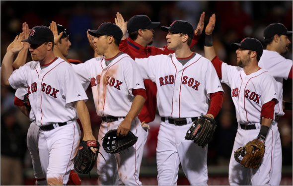 Red Sox vs. Florida Marlins: Red Sox J.D. Drew, Jacoby Ellsbury, Jason Bay and Dustin Pedroia high five after beating the Marlins 8-2.