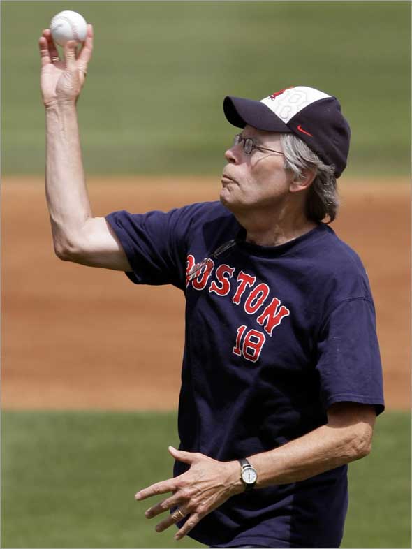 Author Stephen King throws out the ceremonial first pitch prior to the Boston Red Sox vs St. Louis Cardinals spring training baseball game in Fort Myers, Fla., Friday March 27, 2009.