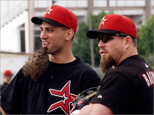 Houston Astros first baseman Tim Bogar (left) wears a fake goatee as he stands with teammate Jeff Bagwell (right) during a workout at their spring training camp in Kissimmee, FL February 23. Several Astros glued on the fake beards to mock Bagwell during the practice.