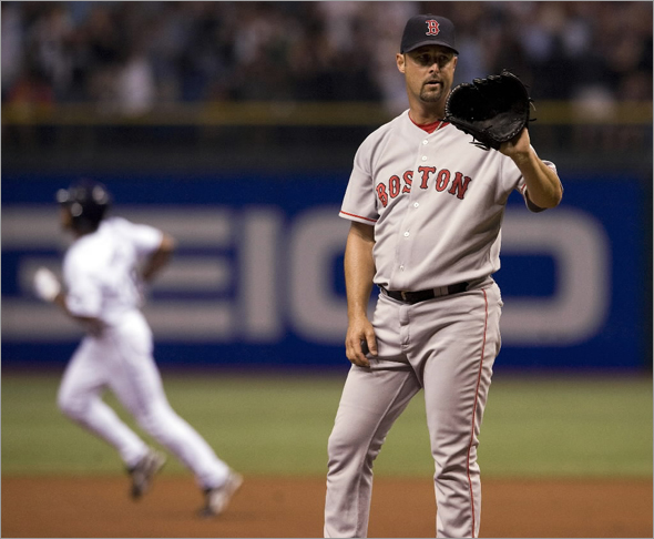 Red Sox starter Tim Wakefield, right, waits for a new ball as Tampa Bay Rays' Fernando Perez circles the bases after hitting a solo home run during the second inning of a baseball game Wednesday, Sept. 17, 2008 in St. Petersburg, Fla.