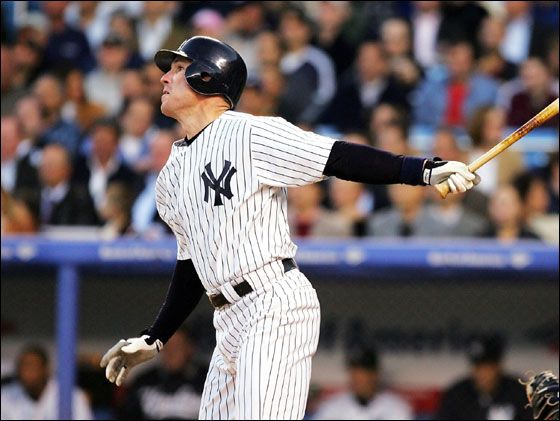 John Flaherty No. 17 of the New York Yankees hits a single to score Alex Rodriguez No. 13, cutting the Seattle Mariners lead to 2-1 in the second inning at Yankee Stadium on May 10, 2005 in Bronx, New York.