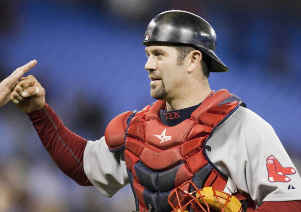 Red Sox catcher Jason Varitek is congratulated by teammates after defeating the Toronto Blue Jays 13-12 in a baseball game in Toronto on Monday April 26, 2009. 
