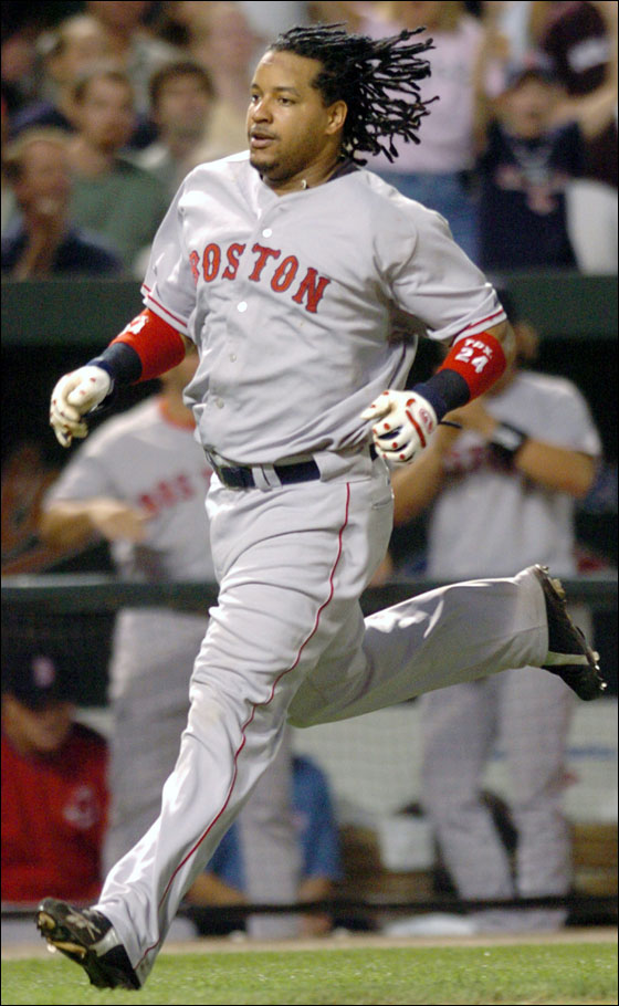 Manny Ramirez races home to score on a double by Trot Nixon in the fifth inning Friday, Sept. 23, 2005, in Baltimore.