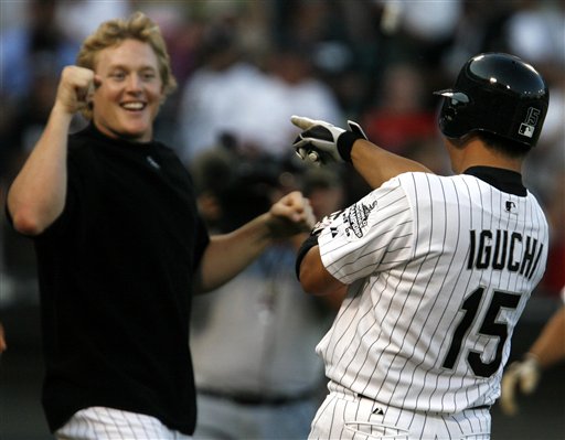 Chicago White Sox Tadahito Iguchi is cheered by teammate Brian Anderson after Iguchi hit the game winning RBI single against the Boston Red Sox in the 19th inning of a baseball game Sunday, July 9, 2006, in Chicago. The White Sox defeated the Red Sox 6-5. 