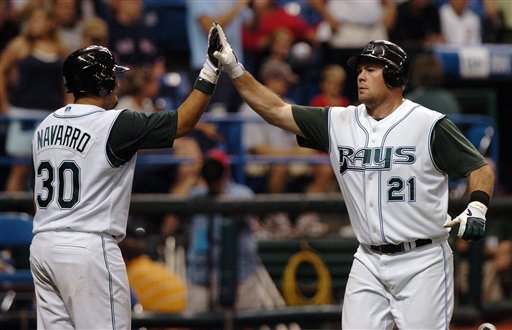Tampa Bay Devil Rays' Dioner Navarro congratulates Ty Wiggington after Wiggington's solo home run off Boston Red Sox starter Curt Schilling during the seventh inning of a baseball game Tuesday, July 4, 2006, at Tropicana Field in St. Petersburg, Fla.