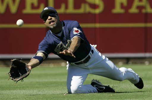 San Diego Padres left fielder Dave Roberts makes a diving catch to rob St Louis Cardinals' Ronnie Belliard of a hit during the fourth inning in their National League Division Series baseball game in San Diego, Thursday, Oct. 5, 2006. 
