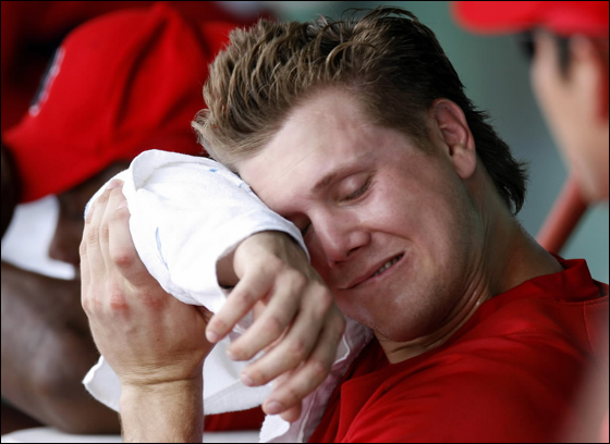 Jonathan Papelbon No. 58 of the Boston Red Sox wipes the sweat from his forehead between innings against the Philadelphia Phillies during a Spring Training game at City of Palms Park March 3, 2007 in Ft. Myers, Florida. Philadelphia won the game 12-9.