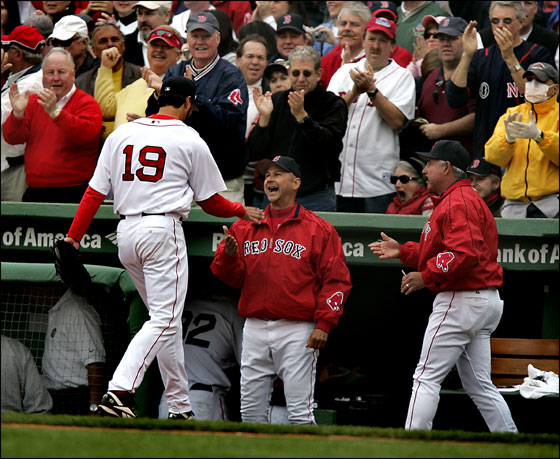 Red Sox manager Terry Francona, center, congratulates starting pitcher Josh Beckett after completing the seventh inning against the Toronto Blue Jays on Opening Day at Fenway Park in Boston, Tuesday April 11, 2006. Beckett gave up one run on three hits in his seven inning outing.  At right is interim pitching coach Al Nipper.