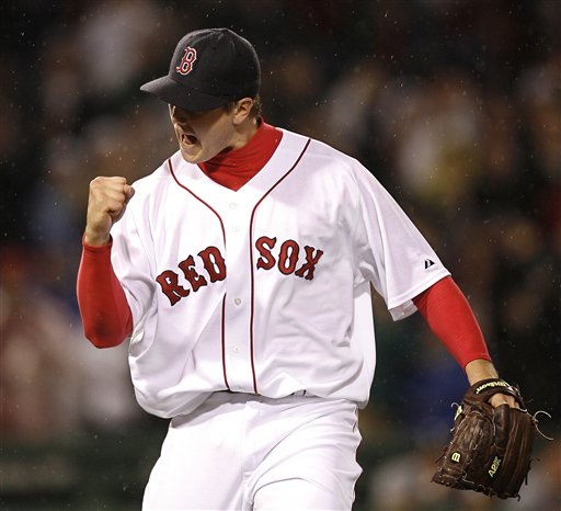 Boston Red Sox pitcher Jonathon Papelbon pumps his fist after the final out of the Red Sox' 2-1 win over the Seattle Mariners in MLB baseball at Fenway Park in Boston, Friday