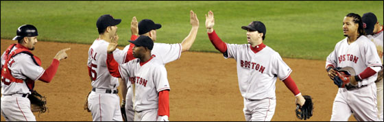 Members of the Red Sox celebrated on the diamond after the 5-3 victory over the New York Yankees.