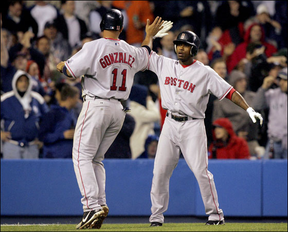 Willie Harris and Alex Gonzalez of the Red Sox celebrated after both scored in the seventh inning against the New York Yankees at Yankee Stadium on May 11, 2006