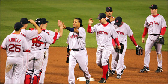 The Red Sox congratulate each other after defeating the Baltimore Orioles 6-5 on May 16, 2006 at Camden Yards