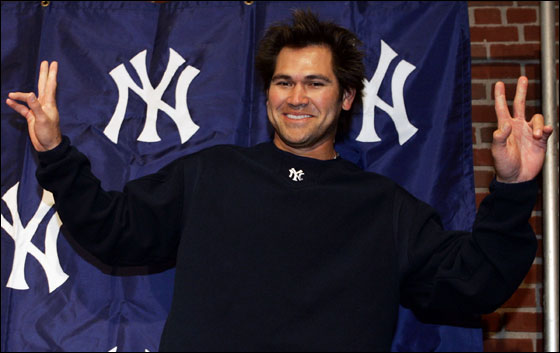 Current New York Yankees outfielder and former Boston Red Sox player, Johnny Damon, gestures to the media after a pre-game news conference in Boston, Monday, May 1, 2006 prior to his first time taking the field at Fenway Park in a Yankees' uniform.