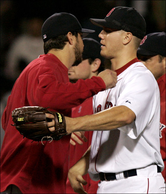 Boston Red Sox vs. Tampa Bay Devil Rays at Fenway Park -- Sox starter Josh Beckett, at left, and closer Jonathan Papelbon hug after Papelbon closed out the game seasling the win for Beckett.