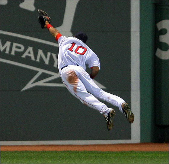 Red Sox CF Coco Crisp makes a great leaping catch to rob the Mets David Wright to end the eighth inning and preserve the Boston lead.