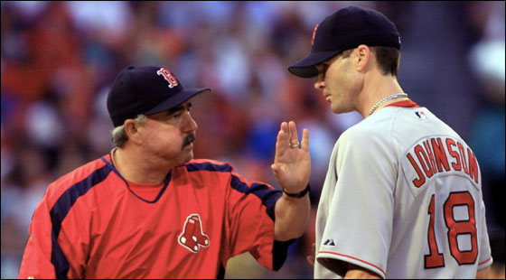 Red Sox bullpen coach Al Nipper talks to pitcher Jason Johnson (18) in the first inning of a interleague baseball game against the Florida Marlins on Friday, June 30, 2006, at Dolphin Stadium in Miami.