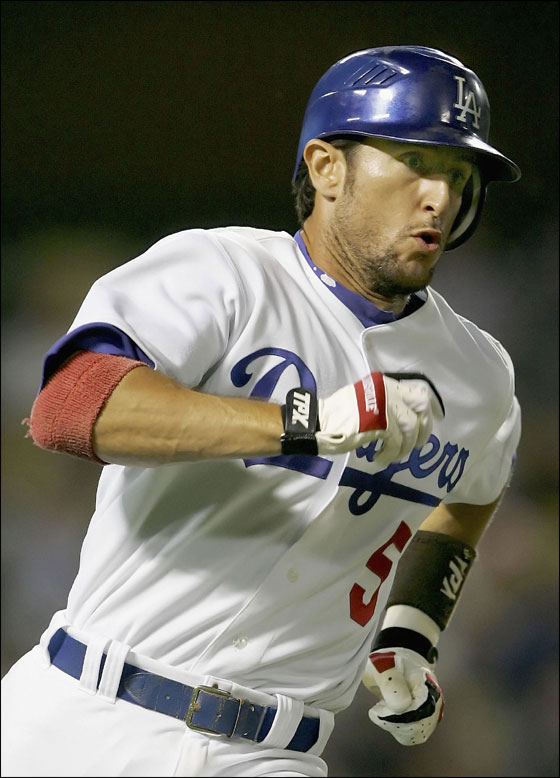 Nomar Garciaparra of the Los Angeles Dodgers runs to first base after hitting a double in the 5th inning against the Arizona Diamondbacks on July 5, 2006 at Dodger Stadium in Los Angeles, California