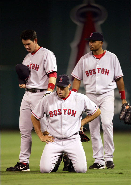 Mark Loretta (left), and Gabe Kapler (center) recovered from their collision while Coco Crisp looked on. Both players remained in the game.