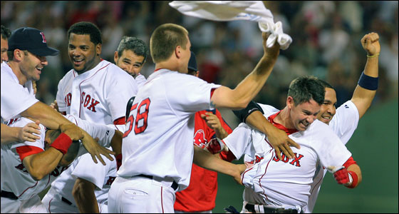 Mark Loretta was mobbed by teammates after his dramatic walkoff double gave Boston a 6-5 victory over the Indians.
