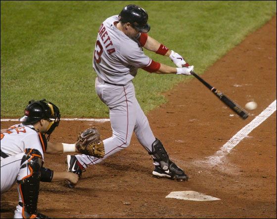 Red Sox batter Mark Loretta stroked the game winning base hit with the bases loaded off of Baltimore Orioles relief pitcher Rodrigo Lopez in the ninth inning of their American League baseball game in Baltimore, Maryland September 14, 2006. Orioles catcher Ramon Hernandez is at left.