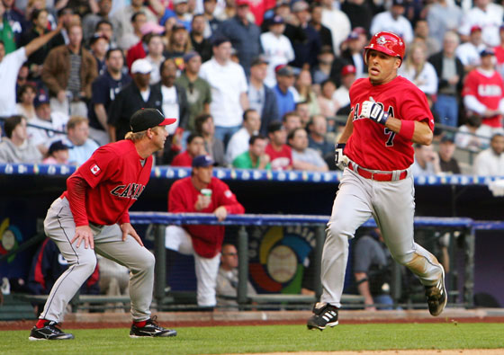 Adam Stern (No. 7) of Team Canada rounds the bases after hitting a inside the park home run against Team USA during the Round 1 Pool B Game of the World Baseball Classic on March 8, 2006 at Chase Field in Phoenix, Arizona.