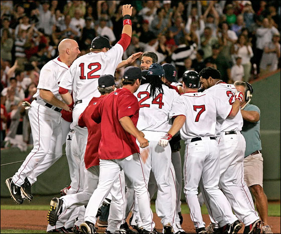 Coco Crisp is at the center of the Red Sox celebration after his game winning double in the 9th inning.