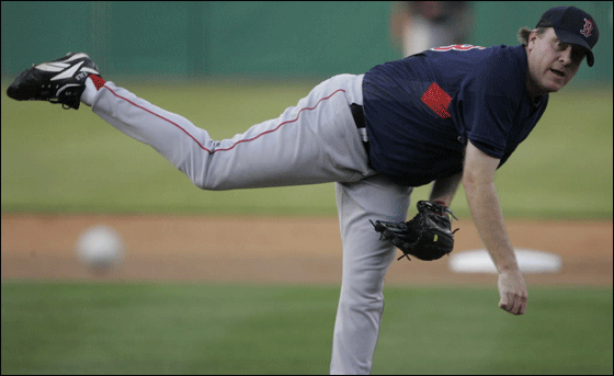 Red Sox starter Curt Schilling delivers during the first inning against the Minnesota Twins during their spring training baseball game in Fort Myers, Fla., Wednesday, March 28, 2007.