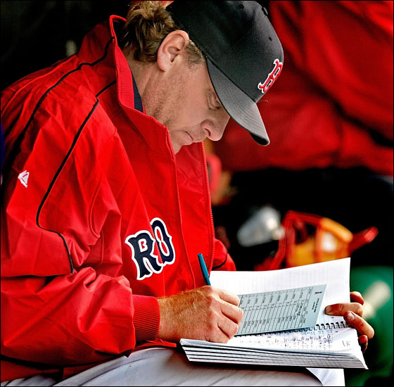Red Sox starter Curt Schilling adds some entries to his notebook after pitching 8 innings, 4 hits and no runs