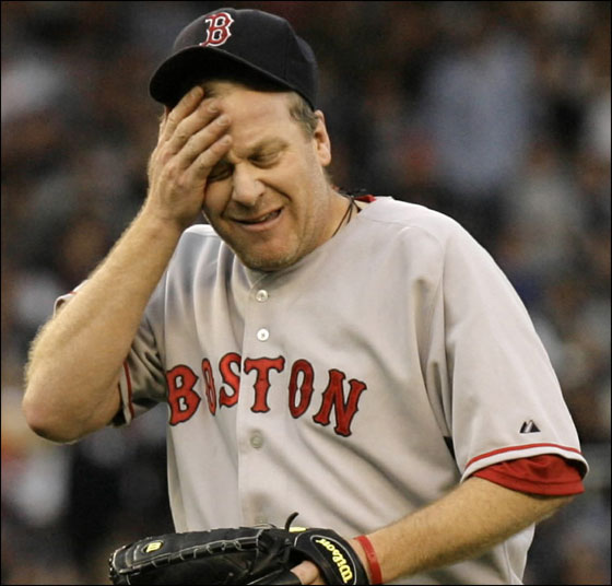 Red Sox ace Curt Schilling wipes his face in the first inning after giving up a two-run home run to New York Yankees Hideki Matsui in the Red Sox 8-3 loss in their baseball game at Yankee Stadium in New York, Wednesday, May 23, 2007. 