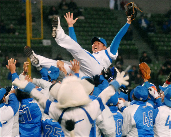 Seibu Lions pitcher Daisuke Matsuzaka is tossed in the air by his teammates in celebration of his transfer to the major league during an exhibition game held as part of the fans' gathering at their home ground of Invoice Seibu Dome in Tokorozawa, west of Tokyo, Thursday, Nov. 23, 2006. Boston Red Sox bid US$51.1 million for the right to negotiate with 26-year-old right-hander, who was the MVP of last spring's World Baseball Classic. 3,6000 Lions fans converged for the annual event, a local report said.